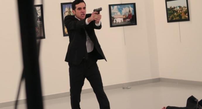 Am I the only one who thinks that the Turkish cop who killed the Russian ambassador is ridiculously hot?
