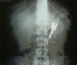 The key to a man's heart is through his stomach the the key to a woman's heart is through her what?
