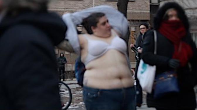 VIDEO: Triggered fat feminist strips to fight against free speech. Thoughts?