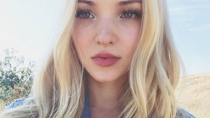 Is she beautiful (10/10) or look weird like she is completely plastic?