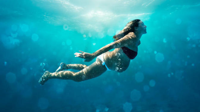 Is a swimming pregnant lady technically a human submarine?