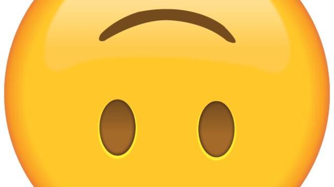 What does the upside down smiley face emoji mean?