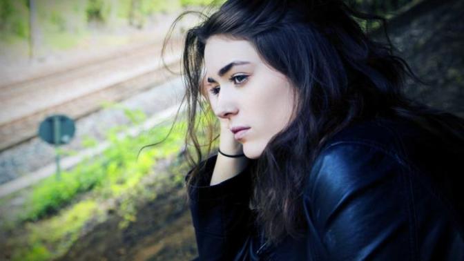 Why does this girl look at me with a kind of sad face?