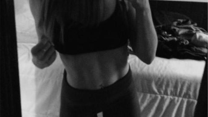 Do you think this girl has her belly button pierced?