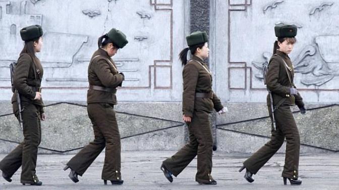 Does anything standout as odd in this photo of North Korean border guards?