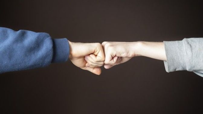 What does a fist bump from the boss mean?