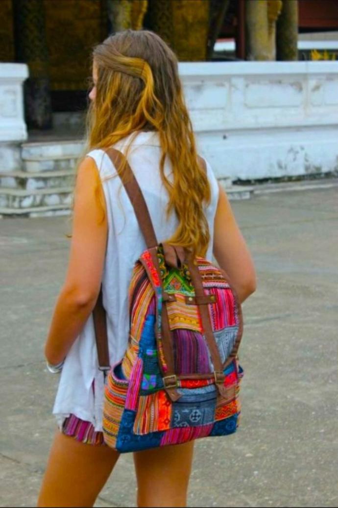 why do girls wear their backpacks with the straps all the way out??