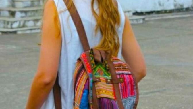 Why do girls wear their backpacks with the straps all the way out?