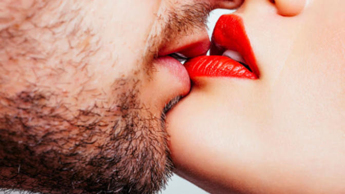 What does it mean when a guy bites your bottom lip when kissing?