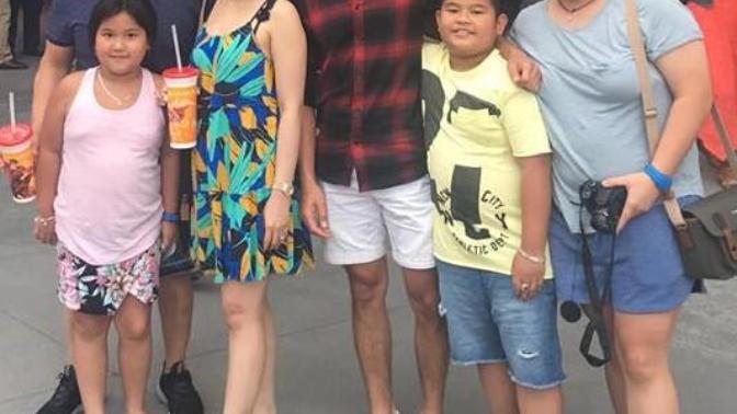 Which one of these men do you think this woman is married to?