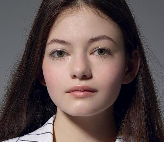 What color are eyes of this girl?