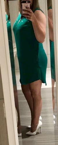 Short green dress and white stilettos is her choice today. You like?