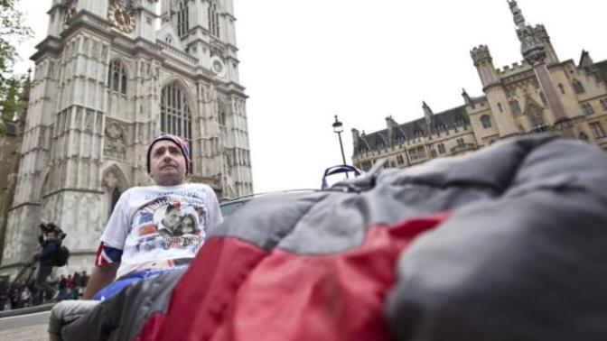 Why would someone choose to travel to a foreign country and then sleep on the streets in a sleeping bag instead of booking a hostel or hotel?