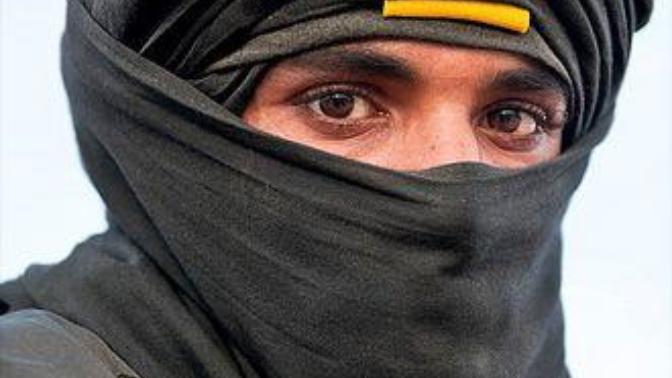 Why do Middle-eastern men covering themselves too and why do many do it in a hot country?