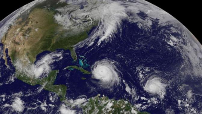 Does the occurrence of three major hurricanes this year prove that global warming is a real phenomenon?
