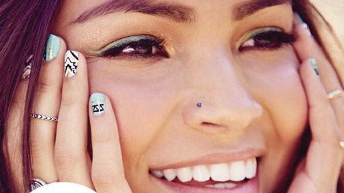 Who has a nose piercing?