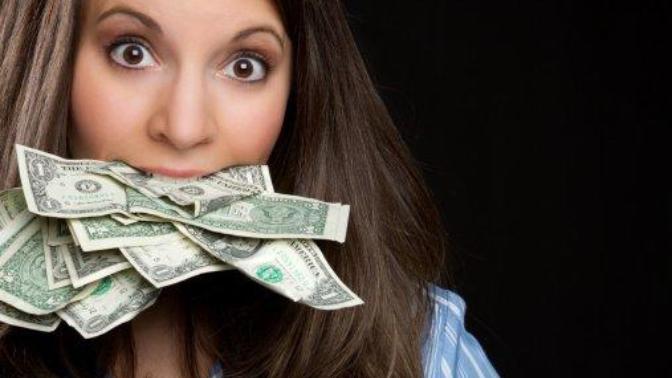 On a scale from 1 to 5 by how much do girls and women love money?