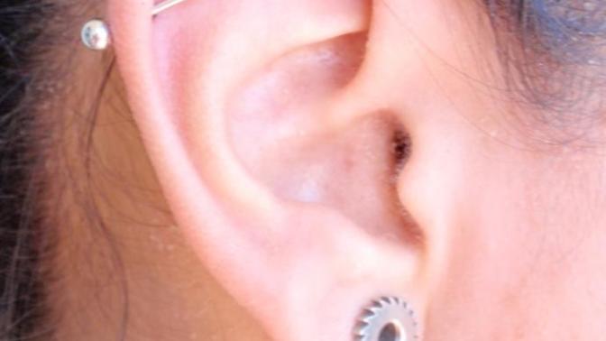 What do you guys/girls think about normal ear piercings? Then think about an industrial ear piercing on one side?