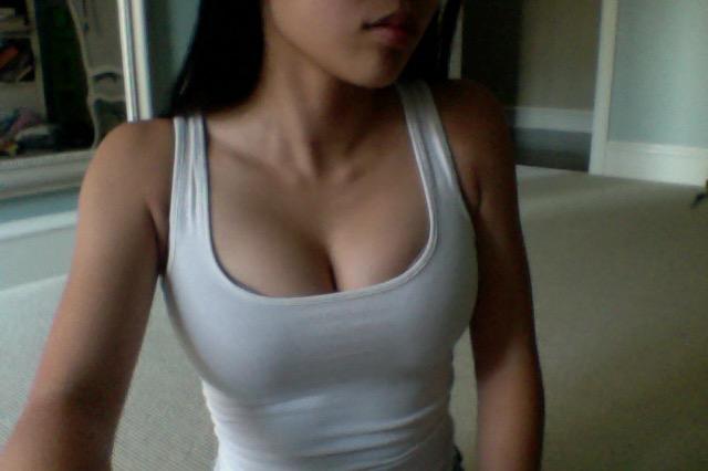Black or white tank top? Which one looks better (Warning: Don't view if you get offended by cleavage)?