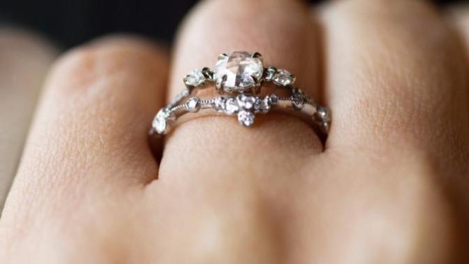 How much did you/your fiancee spend on the engagement ring? How much on the wedding bands? Would you have preferred to spend more/less?