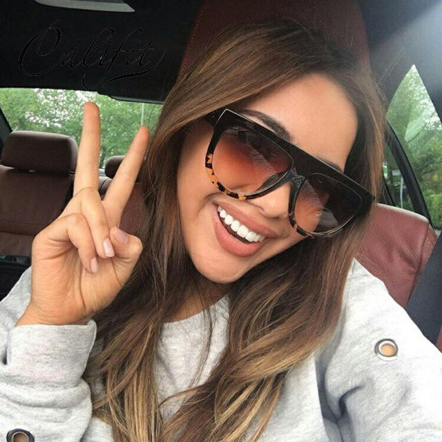 Guys is a lady wearing sunglasses making her look less approachable?
