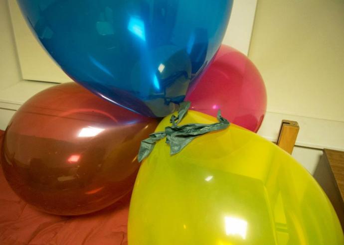 How should I deal with my boyfriend having balloons all around the room?