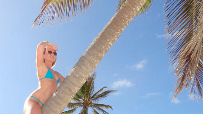 Is it rare for women to climb palm trees in bikinis?