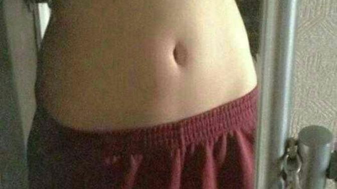 Is there any form of baby bumpage visible in this pic?