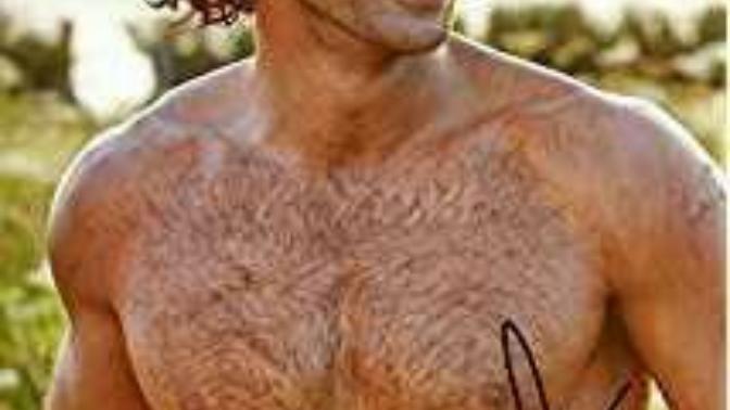 Suggest me a hot male celebrity with olive skin black hair brown eyes?