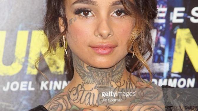 Would you date someone this much tattoed even if she is pretty like the lady in the pic?
