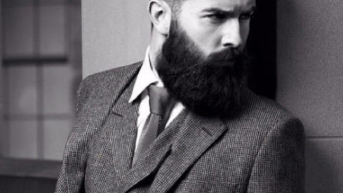 Why are beards strongly associated with masculinity?