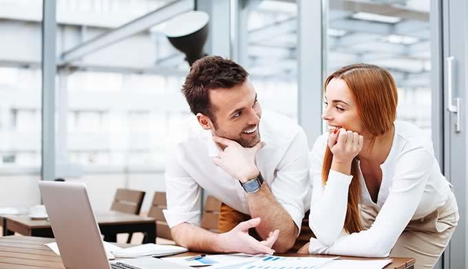 How can I flirt with a guy at work? 