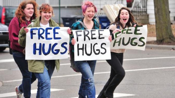 Would you hug a total stranger if they held a "Free Hugs" sign?