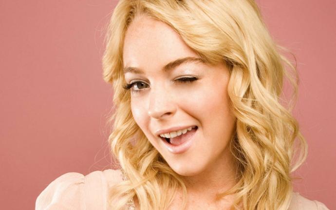 If a woman would wink at you, you would interpret her gesture as?