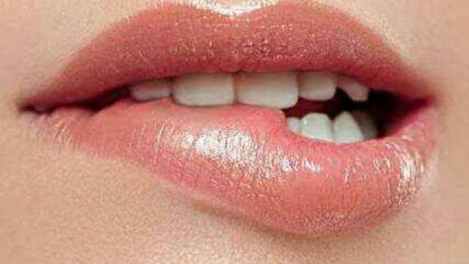 Girls, why do you bites your lips?