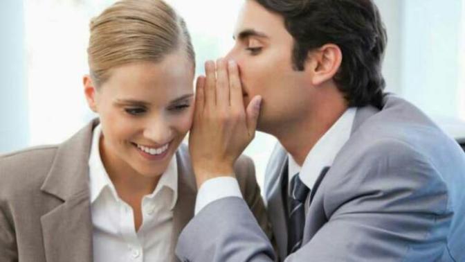 What about these two are whispering in each other's ears?