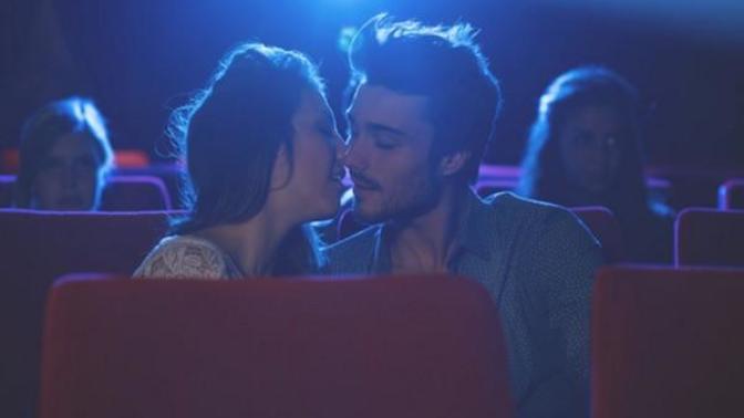 Is it weird to kiss at the movie theater?