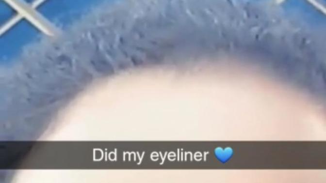 Are her eyes black, dark brown, medium brown, or light brown?