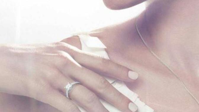 My wife bought me for gift the same engagement ring she wears. Should a man wear it?