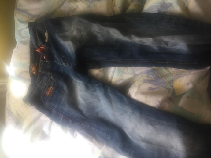 I am 20, I am 5’5.. I have jeans that are 13 years old that fit me. what should I do? should I get rid of them? two of the pictures are kid jeans?