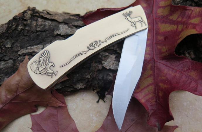 Minted Knives: This is a lost art that is used to create fine art pieces. First we develop our concept with art drawings. When this is finalized, a hand designed plaster casting is made by the artist. This sculpted pieces is then reduced to the actual working size. The end result of this process is a finished knife with deep relief, and incredible details you can see and feel. The knife starts out as blank piece of metal (bronze, pewter, copper, etc.) and then the striking process takes place with hardened steel dies that have the artwork engraved on them. We use the highest grade 440c surgical steel on our blades. The end result is an incredible custom artwork knife that will last a life time. With the custom engraved raised stamped name, this is an incredible piece.. On the back of the knife there is room if you wish to have an engraving of a date, occasion , etc. (Bring to your local engraving shop) .