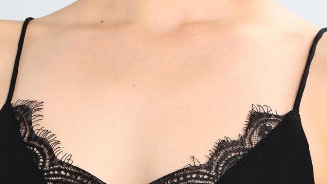Can you wear a bra under a camisole?