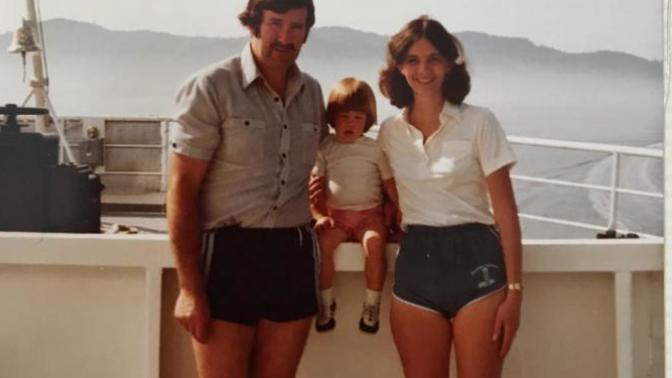 In this photo, who would you say has better legs, the man or the woman?