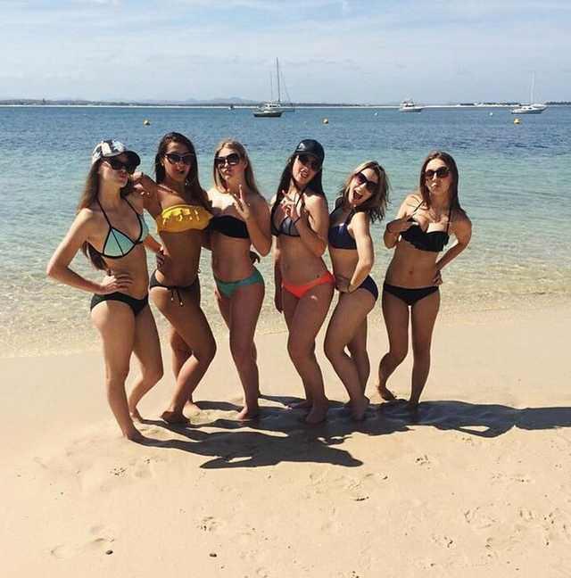 Why do women pose for pictures with one leg bent?