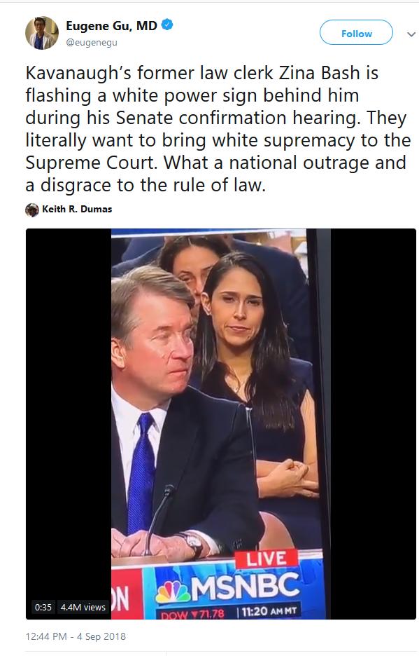 Do you think this woman is making a 'white power' symbol with her fingers?