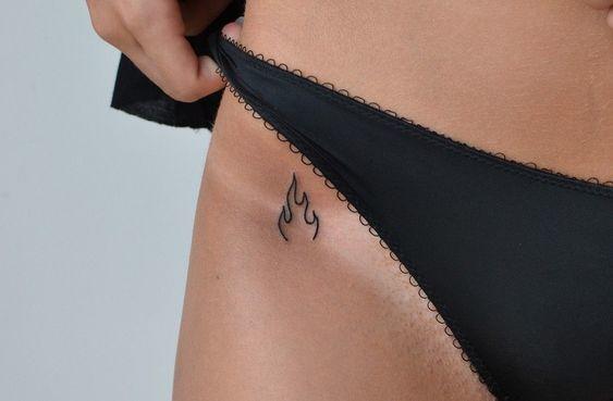 I wanna tattoo his name to be invisible unless I'm naked - lower back or hip or bum?