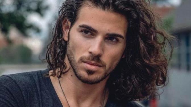 Girls, how many of you find long hair on guys attractive?