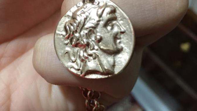 Who is he on my sisters necklace?