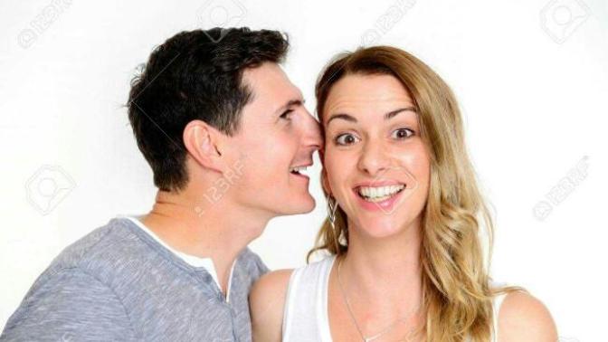 What were both whispering in each other's ears?