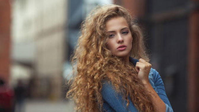 Guys: Do you think a woman is more wild or earthy if she leaves her curly hair natural?